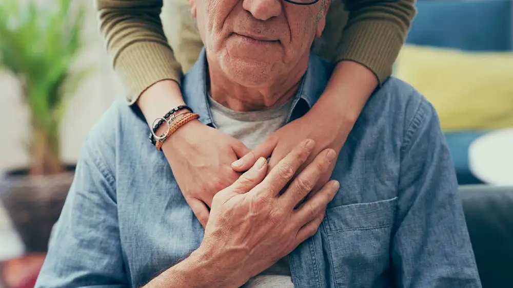 dementia blog image 1 Elderly man being embraced by daughter